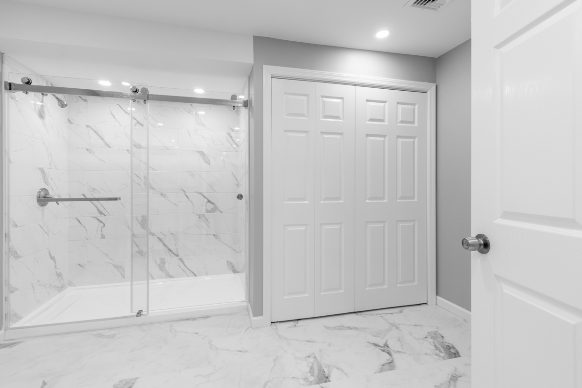 After basement remodeling at Smith Residence in Brookfield CT showing finished walls, ceiling, and trim details