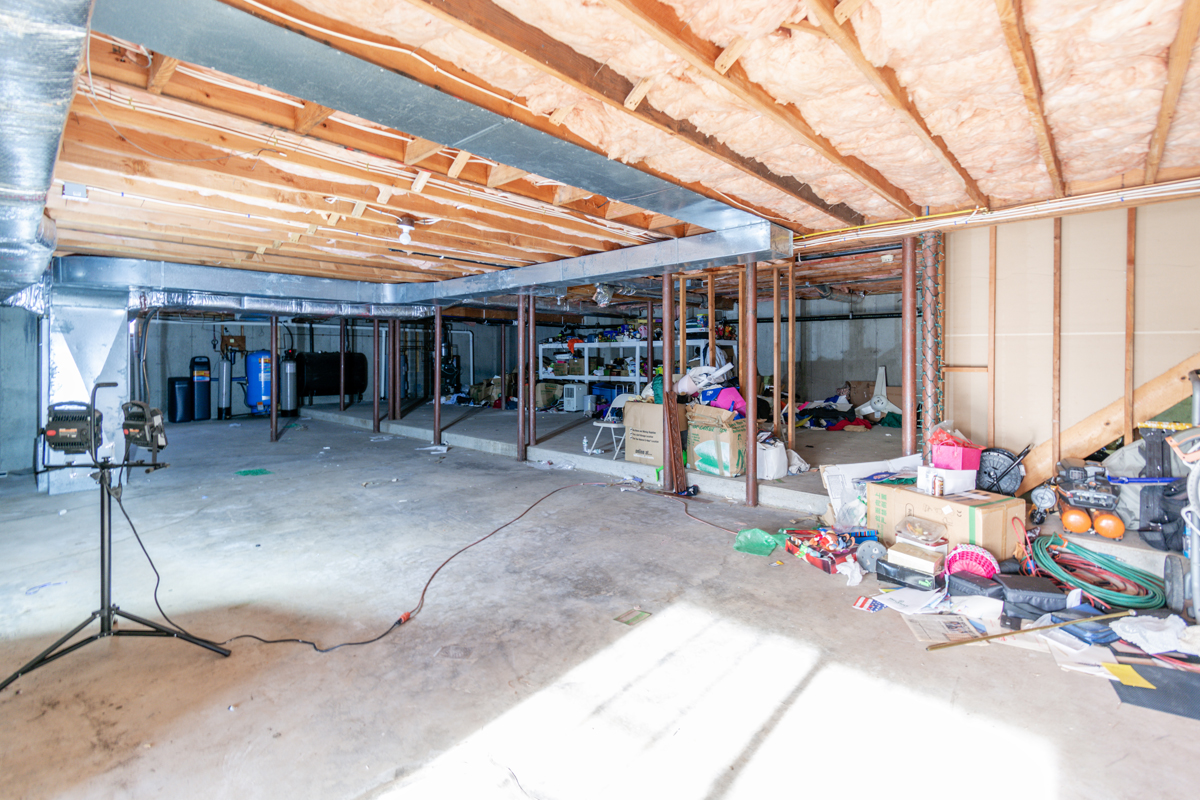 Before basement remodeling at Smith Residence in Brookfield CT showing basement before flooring and final finishes