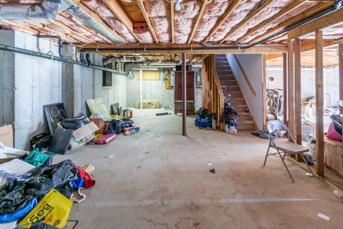 Before basement remodeling at Smith Residence in Brookfield CT showing unfinished basement before remodeling